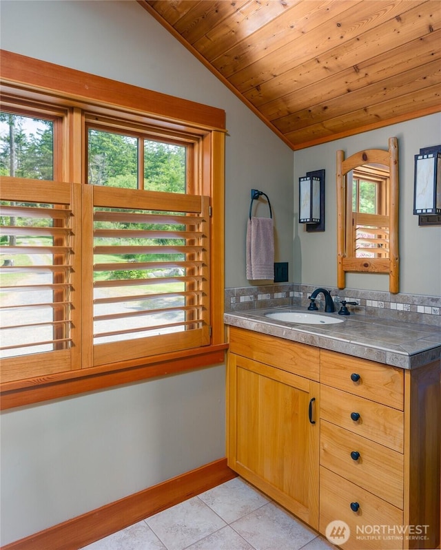 481 Grimes Riker Ln, Lopez Island, WA 98261 - bathroom with lofted ceiling, vanity, tile patterned flooring, plenty of natural light, and wooden ceiling