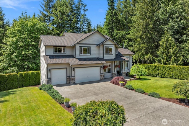 11024 127th Ave NE, Lake Stevens, WA 98258 - craftsman house featuring a garage, concrete driveway, stone siding, and a front lawn