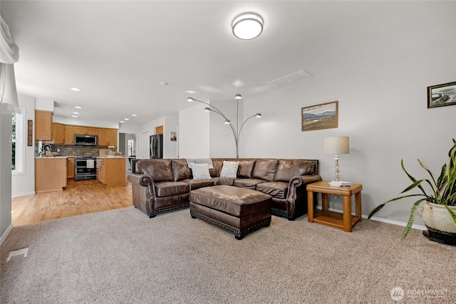 11024 127th Ave NE, Lake Stevens, WA 98258 - living area with light carpet, baseboards, and recessed lighting