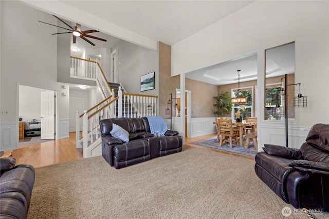 11024 127th Ave NE, Lake Stevens, WA 98258 - living room with stairway, a chandelier, carpet floors, ceiling fan, and wainscoting