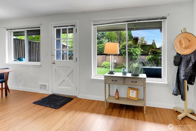 21120 77th Pl W Unit 104, Edmonds, WA 98026 - entrance foyer with wood finished floors, baseboards, and plenty of natural light