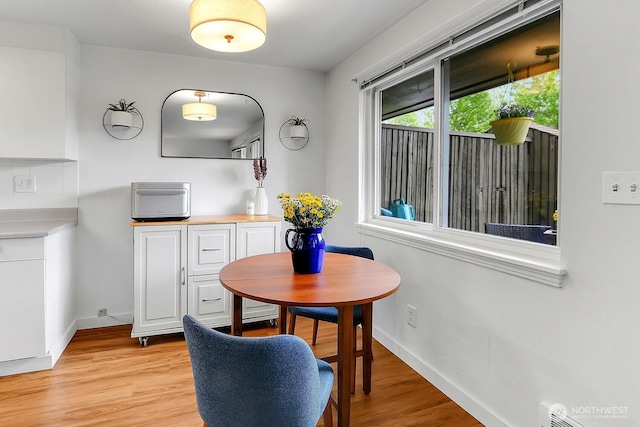 21120 77th Pl W Unit 104, Edmonds, WA 98026 - dining area with light wood-style flooring and baseboards