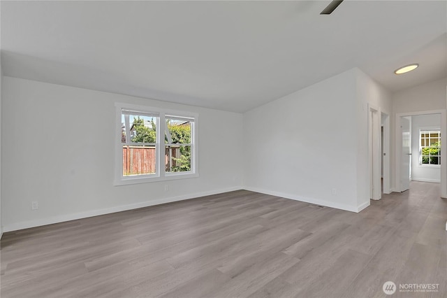 7725 203rd Street Ct E Unit 27, Spanaway, WA 98387 - empty room featuring wood finished floors, baseboards, and a ceiling fan