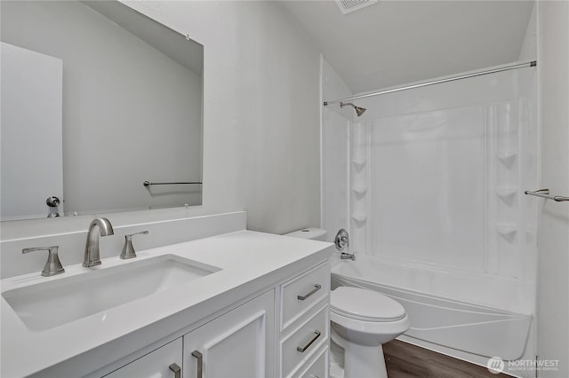 7725 203rd Street Ct E Unit 27, Spanaway, WA 98387 - full bath featuring toilet, vanity, bathing tub / shower combination, and wood finished floors