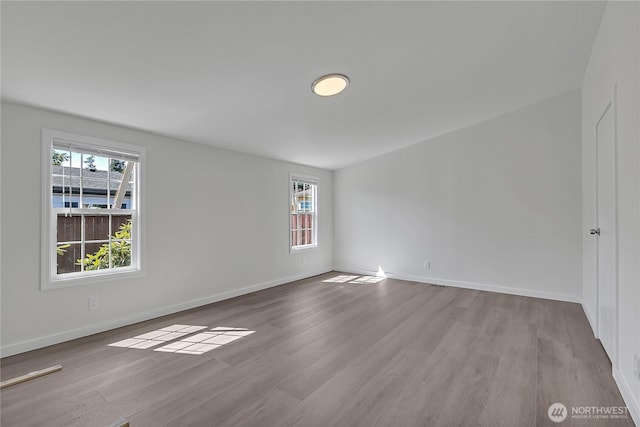 7725 203rd Street Ct E Unit 27, Spanaway, WA 98387 - empty room with wood finished floors and baseboards