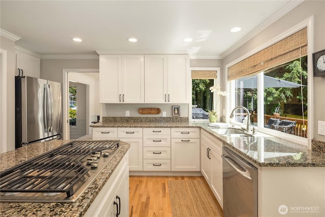 25819 NE 9th St, Sammamish, WA 98074 - kitchen featuring stainless steel appliances, stone counters, light wood finished floors, white cabinets, and crown molding
