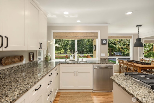 25819 NE 9th St, Sammamish, WA 98074 - kitchen with ornamental molding, light wood-type flooring, appliances with stainless steel finishes, white cabinetry, and light stone counters