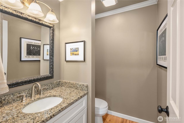 25819 NE 9th St, Sammamish, WA 98074 - bathroom with vanity, crown molding, and wood finished floors