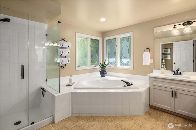 25819 NE 9th St, Sammamish, WA 98074 - bathroom featuring vanity, a garden tub, a shower stall, tile patterned flooring, and recessed lighting