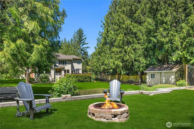 25819 NE 9th St, Sammamish, WA 98074 - view of yard featuring a fire pit and a storage shed