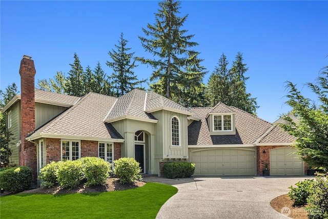25819 NE 9th St, Sammamish, WA 98074 - view of front of house featuring an attached garage, driveway, a chimney, and roof with shingles