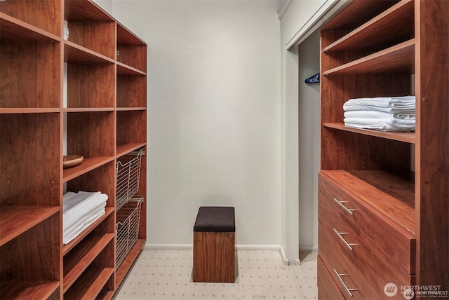 10762 Exeter Ave NE, Seattle, WA 98125 - walk in closet featuring tile patterned floors
