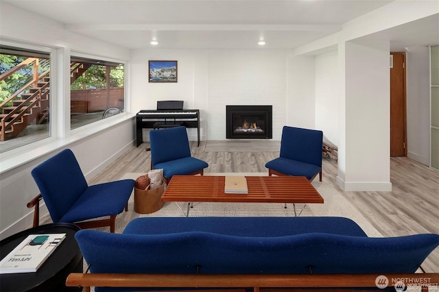 10762 Exeter Ave NE, Seattle, WA 98125 - sitting room with wood finished floors, a fireplace, baseboards, and recessed lighting
