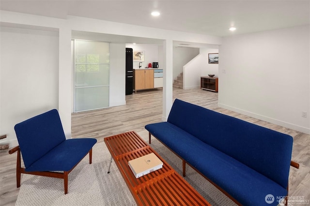 10762 Exeter Ave NE, Seattle, WA 98125 - living area with light wood-style flooring, recessed lighting, stairway, and baseboards