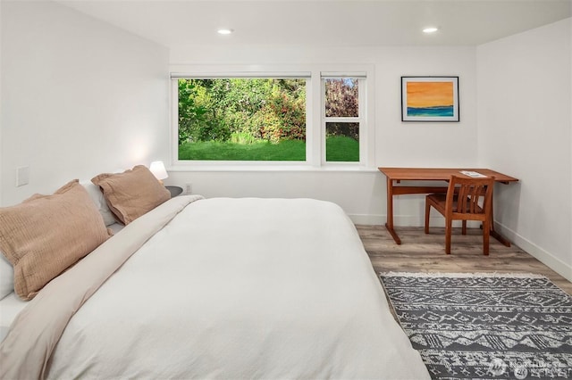 10762 Exeter Ave NE, Seattle, WA 98125 - bedroom featuring wood finished floors, baseboards, and recessed lighting