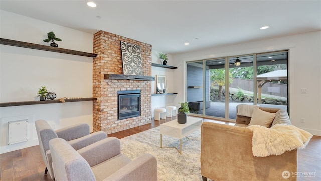 25625 SE Olympic Ln, Black Diamond, WA 98010 - living room featuring wood finished floors, recessed lighting, a brick fireplace, and ceiling fan
