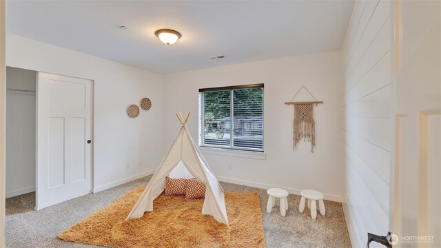 25625 SE Olympic Ln, Black Diamond, WA 98010 - rec room with carpet flooring and baseboards