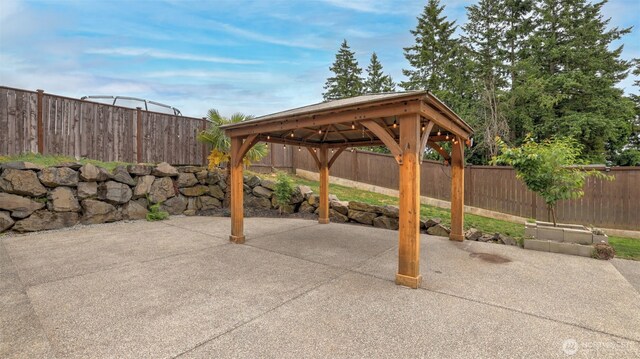 25625 SE Olympic Ln, Black Diamond, WA 98010 - fenced backyard featuring a gazebo and a patio area