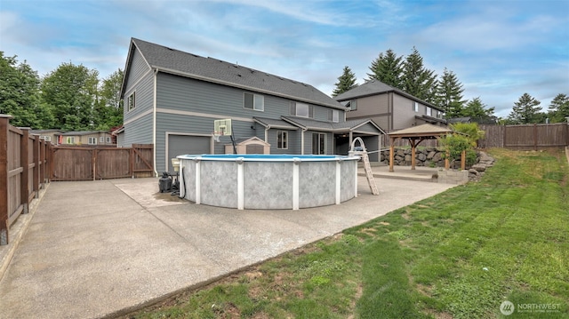25625 SE Olympic Ln, Black Diamond, WA 98010 - rear view of property featuring a gazebo and a patio area