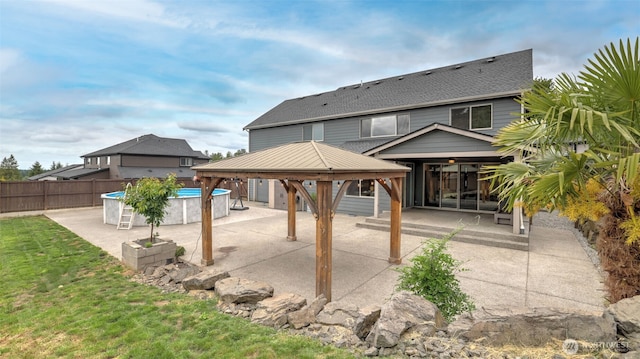 25625 SE Olympic Ln, Black Diamond, WA 98010 - rear view of property with a gazebo, a shingled roof, and a patio