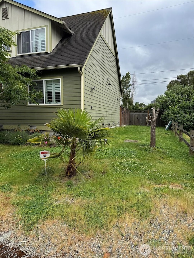 5001 S 122nd Ln, Tukwila, WA 98178 - view of side of home featuring board and batten siding and a shingled roof