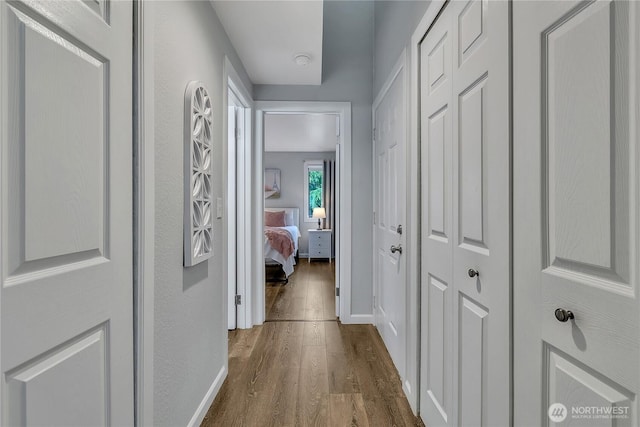 17311 119th Ln SE Unit J4, Renton, WA 98058 - corridor featuring dark wood-type flooring and baseboards