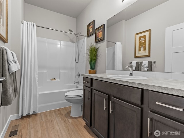 752 Parkland Loop, Sedro Woolley, WA 98284 - bathroom with vanity, shower / bathtub combination with curtain, and wood finished floors