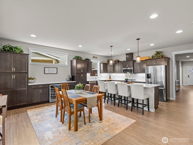 752 Parkland Loop, Sedro Woolley, WA 98284 - dining area with wine cooler, light wood-style flooring, and recessed lighting