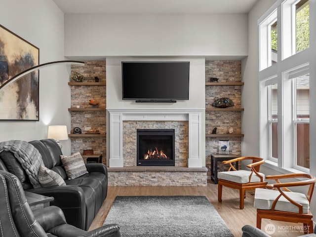 752 Parkland Loop, Sedro Woolley, WA 98284 - living area featuring wood finished floors and a stone fireplace