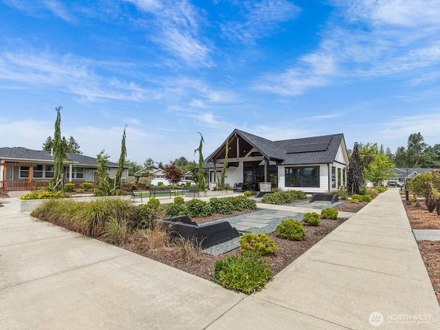 752 Parkland Loop, Sedro Woolley, WA 98284 - view of front facade featuring roof mounted solar panels and roof with shingles