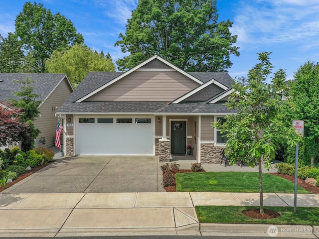 752 Parkland Loop, Sedro Woolley, WA 98284 - craftsman-style home featuring a garage, concrete driveway, stone siding, and a shingled roof