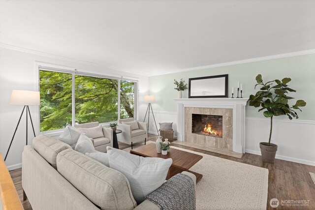 19203 Whitman Ave N, Shoreline, WA 98133 - living area with a tiled fireplace, wood finished floors, and crown molding