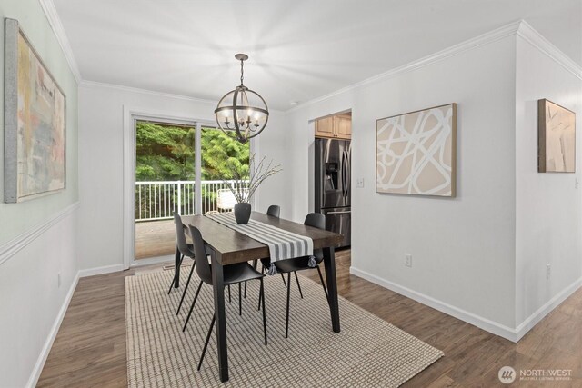 19203 Whitman Ave N, Shoreline, WA 98133 - dining room with a chandelier, wood finished floors, baseboards, and ornamental molding