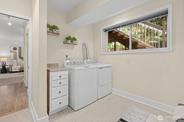 19203 Whitman Ave N, Shoreline, WA 98133 - laundry room with washing machine and clothes dryer and baseboards