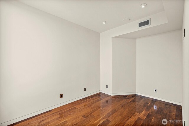 302 N Stadium Way Unit 302, Tacoma, WA 98403 - spare room with dark wood-type flooring, baseboards, and recessed lighting