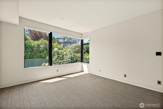 302 N Stadium Way Unit 302, Tacoma, WA 98403 - unfurnished room with carpet flooring and baseboards