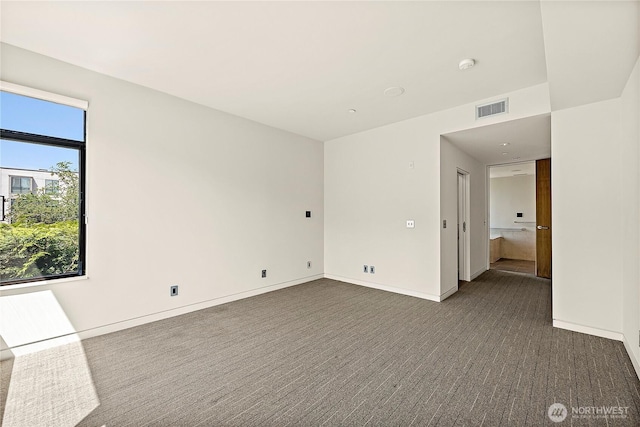 302 N Stadium Way Unit 302, Tacoma, WA 98403 - spare room with dark colored carpet, a smoke detector, and baseboards