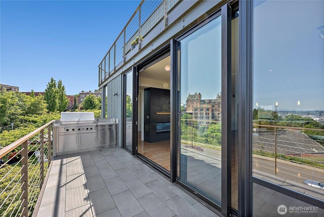 302 N Stadium Way Unit 302, Tacoma, WA 98403 - balcony with a grill