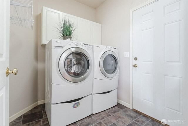 2921 Haggin St, Bellingham, WA 98226 - laundry room with independent washer and dryer, baseboards, cabinet space, and dark stone finish flooring
