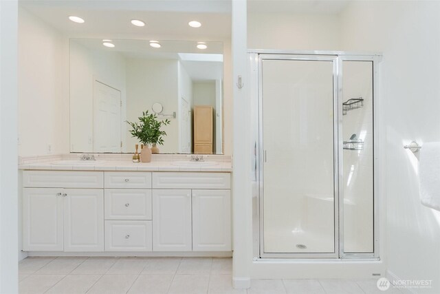 2921 Haggin St, Bellingham, WA 98226 - bathroom featuring a shower stall, double vanity, recessed lighting, tile patterned flooring, and baseboards