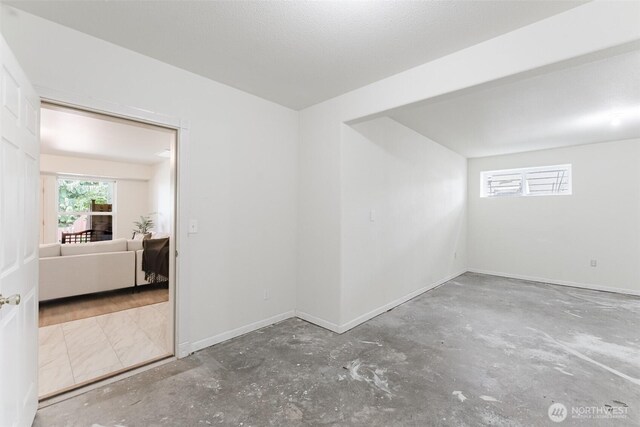 2921 Haggin St, Bellingham, WA 98226 - empty room featuring unfinished concrete flooring and baseboards