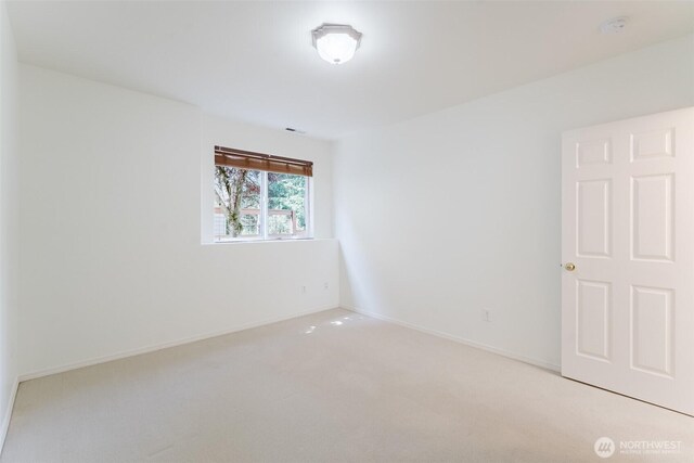 2921 Haggin St, Bellingham, WA 98226 - empty room featuring light carpet, a smoke detector, and baseboards