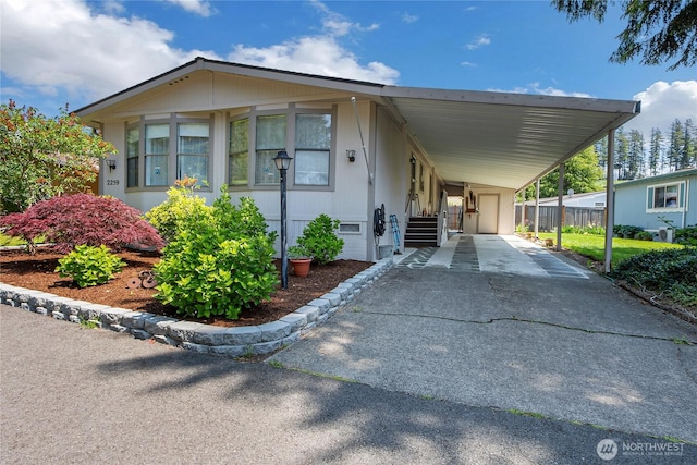 2259 Rincon Ave, Enumclaw, WA 98022 - manufactured / mobile home featuring driveway and a carport