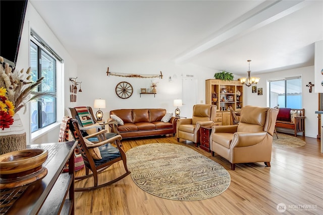 2259 Rincon Ave, Enumclaw, WA 98022 - living room with a chandelier, light wood-style floors, and plenty of natural light