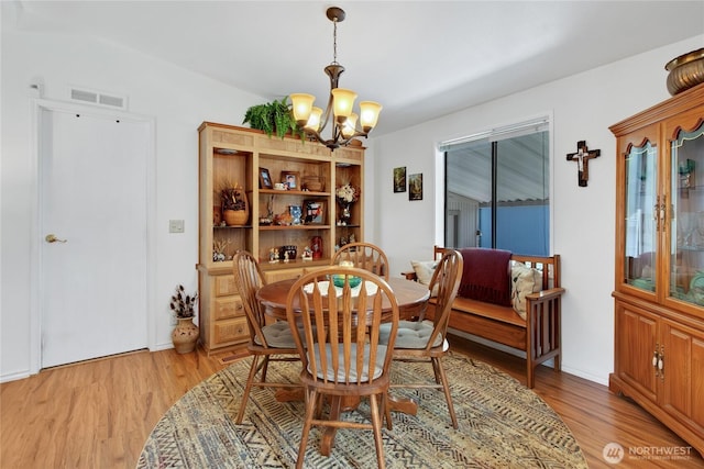 2259 Rincon Ave, Enumclaw, WA 98022 - dining space with a chandelier and light wood-style floors