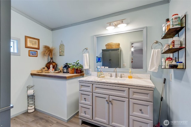 2259 Rincon Ave, Enumclaw, WA 98022 - bathroom featuring vanity, wood finished floors, and baseboards