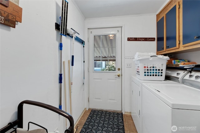 2259 Rincon Ave, Enumclaw, WA 98022 - laundry room featuring cabinet space, washing machine and dryer, light tile patterned floors, and ornamental molding