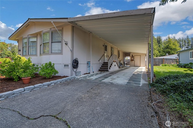 2259 Rincon Ave, Enumclaw, WA 98022 - view of front facade featuring crawl space, a carport, asphalt driveway, and entry steps
