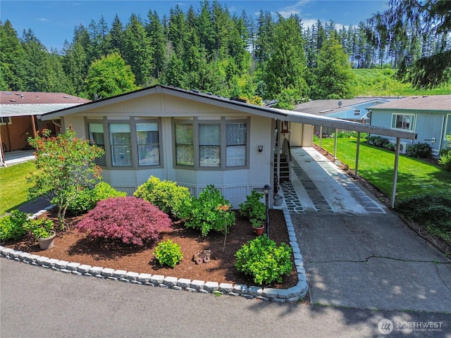 2259 Rincon Ave, Enumclaw, WA 98022 - view of front of home featuring an attached carport, concrete driveway, and a front yard