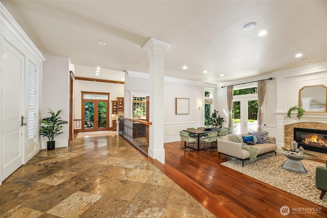 8380 SE 43rd St, Mercer Island, WA 98040 - entrance foyer featuring french doors, stone tile flooring, a decorative wall, crown molding, and recessed lighting